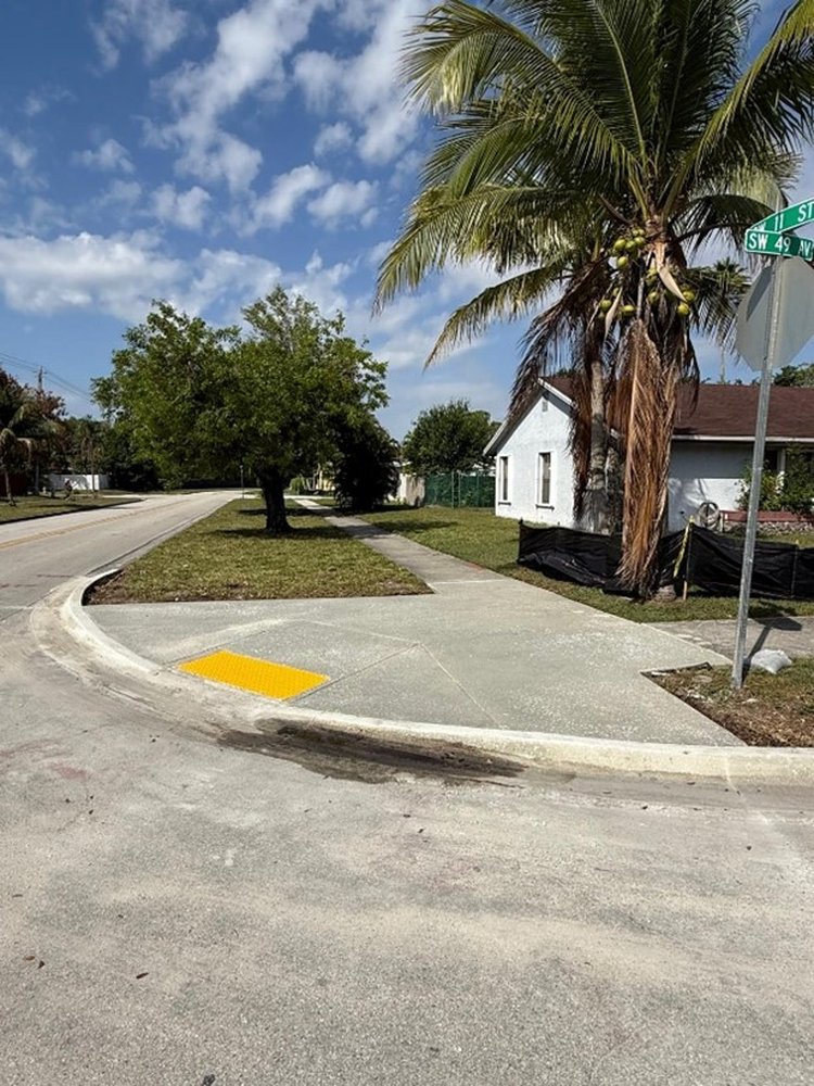 New concrete sidewalk with curb and gutter East of SR 7   April 2025